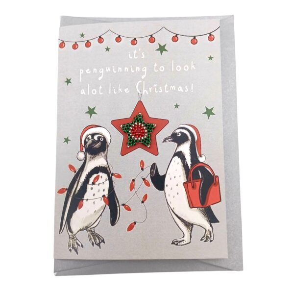 A cute Christmas card featuring a cheerful pair of African penguins.