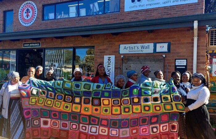 Yarn-bombing-project-croche-squares-with-crafters